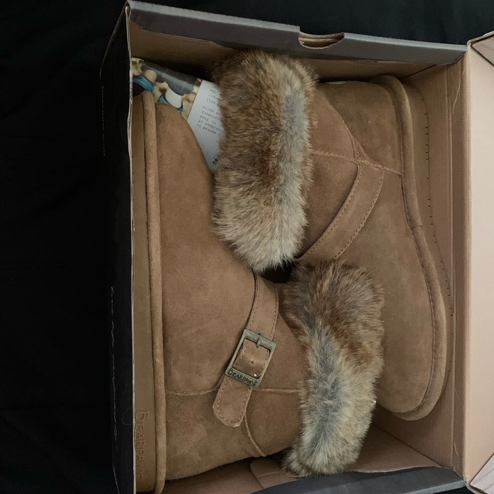 Brand new pair of sturdy bear paw boots .